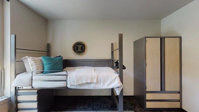 Loft bed white blankets pillows wardrobe bedroom at 7000 Campus Living Apartments in Shoreline Student Accommodation