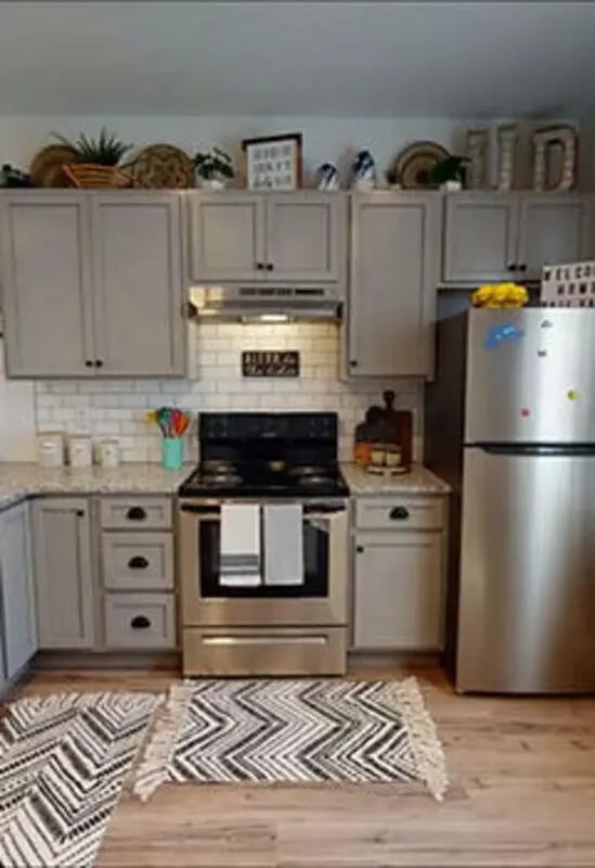 Modern kitchen with stainless steel appliances and grey cabinets Kitchen at The Rail Yard in Newark Student Accommodation