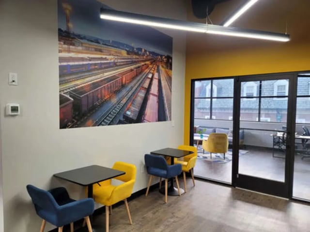 Seating area with tables and chairs lounge living room at The Rail Yard in Newark Student Accommodation
