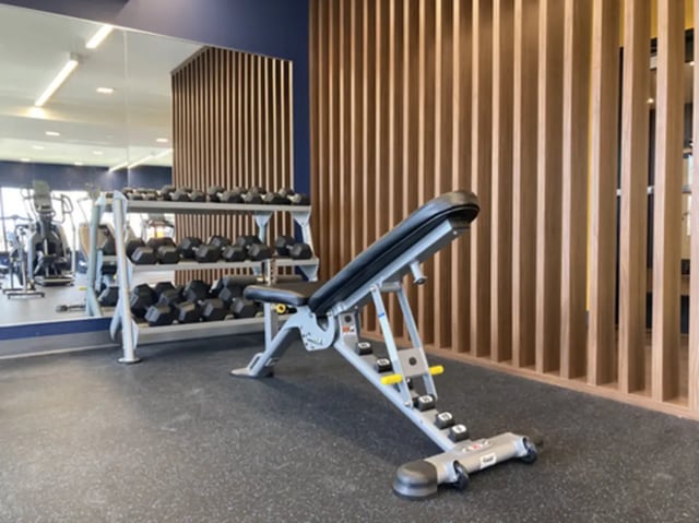 Adjustable weight bench and dumbbells gym at The Rail Yard in Newark Student Accommodation
