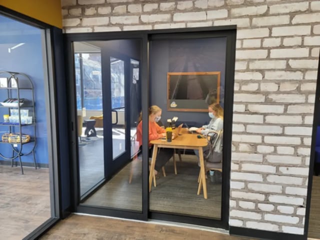 Students studying at a table within a room. at The Rail Yard in Newark Student Accommodation