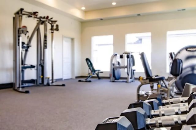 Weight machines dumbbells and exercise bench gym at Sundance Apartments - BYU-Idaho Approved Housing in Rexburg Student Accommodation