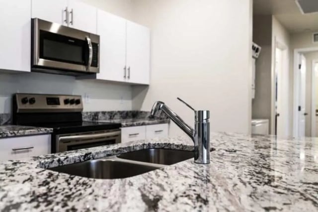 Granite countertop sink and faucet kitchen at Sundance Apartments - BYU-Idaho Approved Housing in Rexburg Student Accommodation