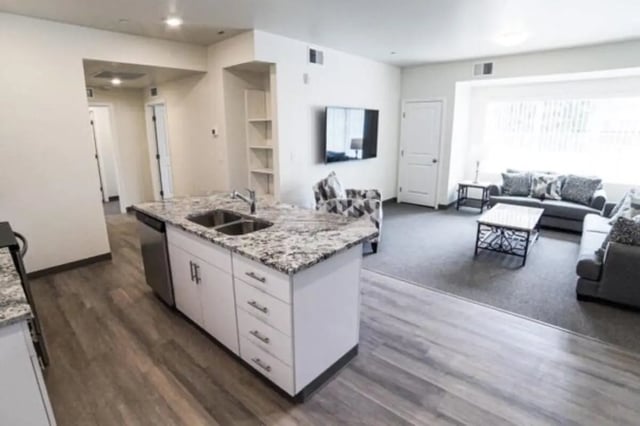 Kitchen island sofas coffee table living area at Sundance Apartments - BYU-Idaho Approved Housing in Rexburg Student Accommodation