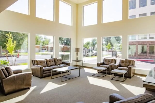 Brown sofas coffee tables ottomans modern living room at Sundance Apartments - BYU-Idaho Approved Housing in Rexburg Student Accommodation