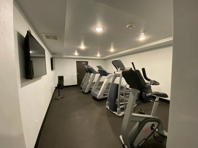 Treadmills ellipticals and stationary bikes gym at The Towers Two - Women Approved Housing in Rexburg Student Accommodation