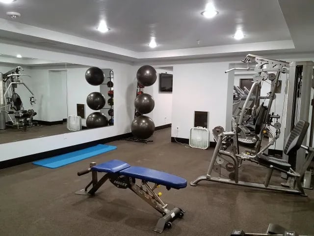 Gym with weights exercise machines and exercise balls Gym at The Towers Two - Women Approved Housing in Rexburg Student Accommodation