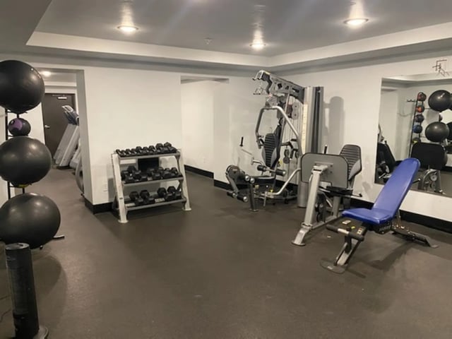 Gym with weights machines and medicine balls gym at The Towers Two - Women Approved Housing in Rexburg Student Accommodation