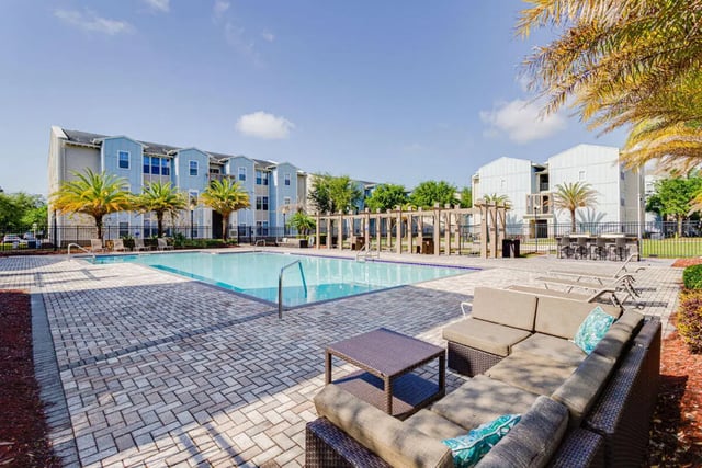 Apartment buildings pool lounge furniture exterior at Hawks Landing in Oxford Student Accommodation