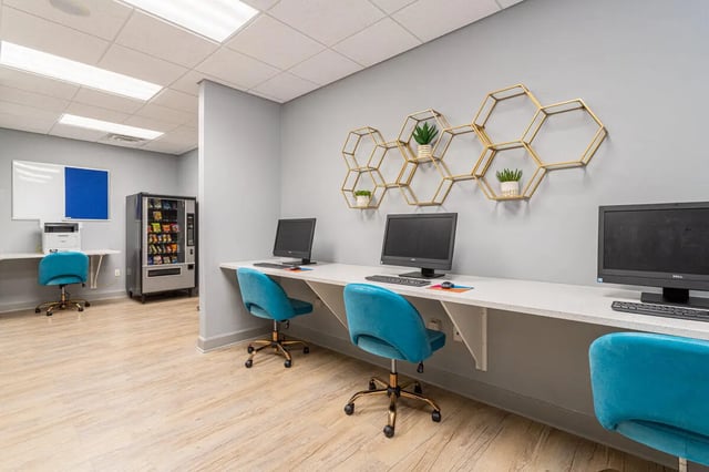 Computers, chairs, vending machine, study area at Hawks Landing in Oxford Student Accommodation