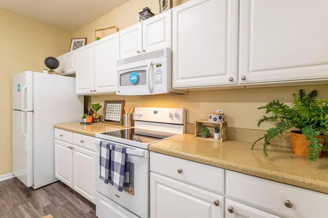 Refrigerator stove microwave white cabinets kitchen at Hawks Landing in Oxford Student Accommodation