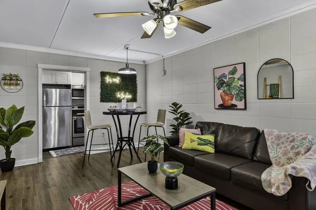 Sofa coffee table dining table and kitchen living room at 759 Basin LLC in Tallahassee Student Accommodation