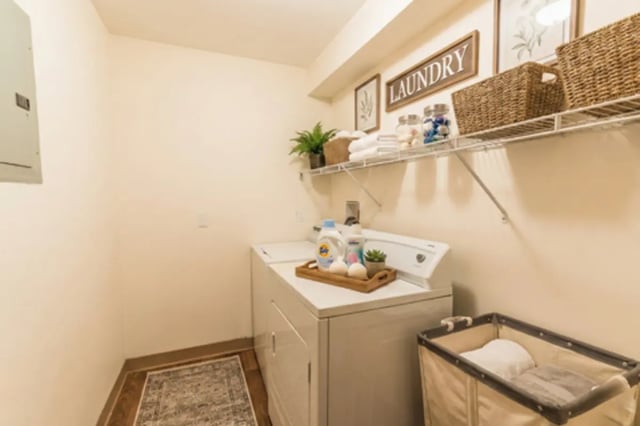 Washer dryer laundry basket and shelving Laundry Room at Waters Edge Apartments in East Lansing Student Accommodation