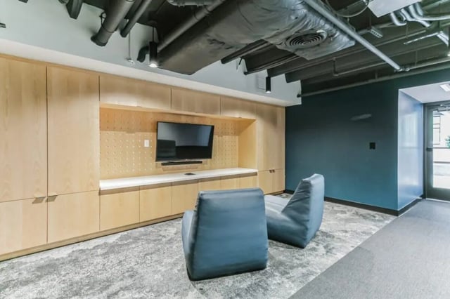 Television and beanbag chairs in lounge at Current Midtown Apartments in Williamsburg Student Accommodation