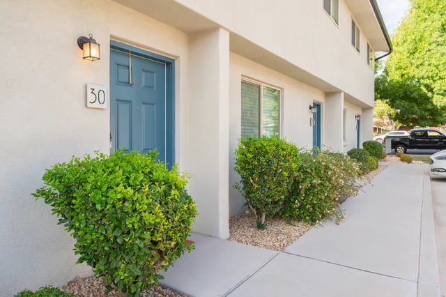 Blue door numbered 30 exterior entrance exterior at 7th & University Apartments in St. George Student Accommodation