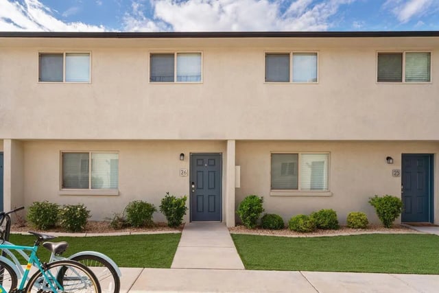 Two bicycles on lawn exterior at 7th & University Apartments in St. George Student Accommodation