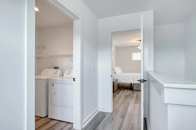 Washer dryer unit with bed in adjacent bedroom interior. at Haven Blacksburg in Blacksburg Student Accommodation
