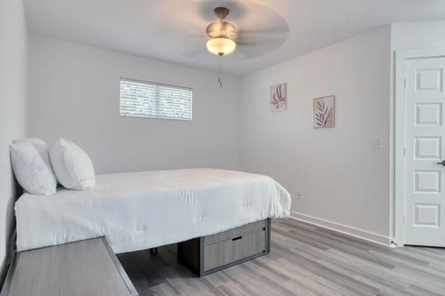 White bed with storage ceiling fan artwork bedroom at Haven Blacksburg in Blacksburg Student Accommodation
