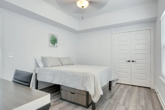 Bed desk chair and double doors bedroom at Haven Blacksburg in Blacksburg Student Accommodation