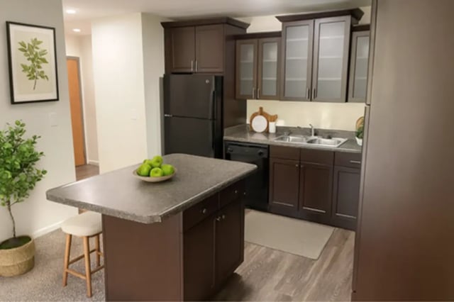 Kitchen island black refrigerator modern cabinetry kitchen at Americana Apartments in East Lansing Student Accommodation