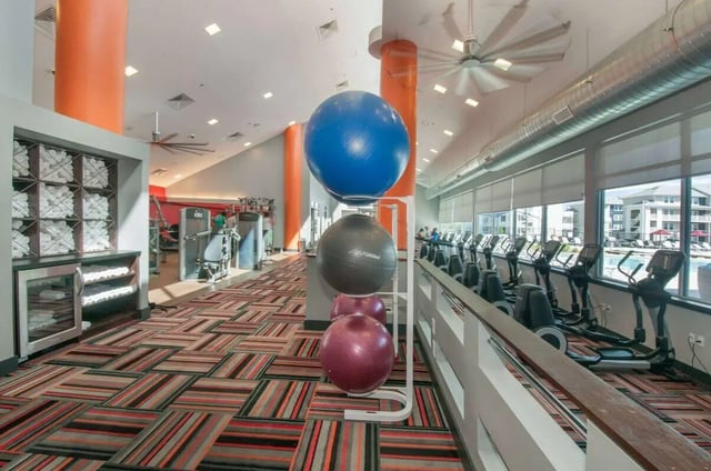 Exercise balls towels and cardio machines gym at The Ave at Norman Apartments in Norman Student Accommodation