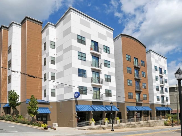 Modern apartment building with balconies and blue awnings exterior at Eclipse on Broad in Athens Student Accommodation