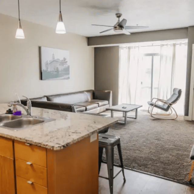 Kitchen sofa coffee table rocking chair living room at Cedars Women's Housing in Rexburg Student Accommodation