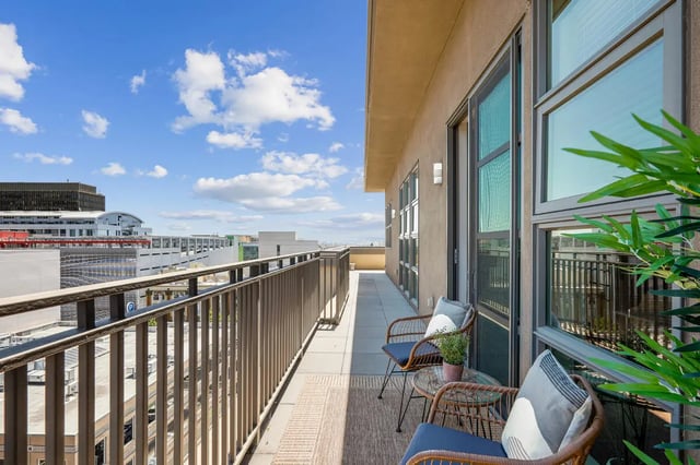 Balcony with chairs table and plants exterior at Stonefire Berkeley in Berkeley Student Accommodation