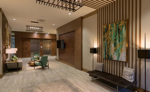 Elevators sofas chairs and artwork common area at Stonefire Berkeley in Berkeley Student Accommodation