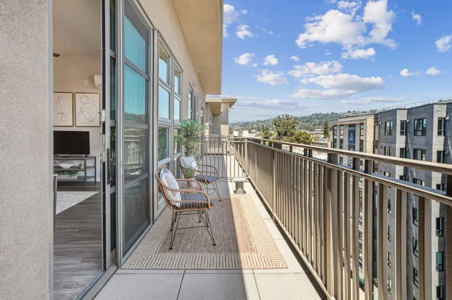 Two chairs on balcony with rug and view balcony at Stonefire Berkeley in Berkeley Student Accommodation