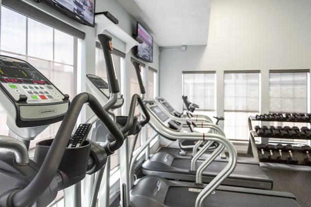 Elliptical machines treadmills dumbbells gym at The Redland Apartments in Athens Student Accommodation
