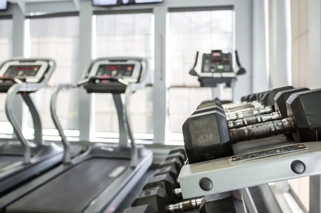 Dumbbells and treadmills in gym gym area at The Redland Apartments in Athens Student Accommodation