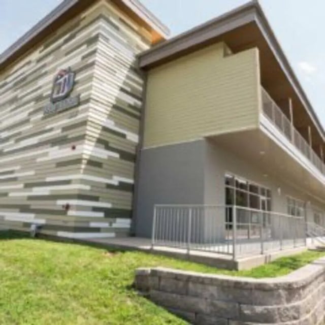 Modern building facade with balconies and grassy exterior exterior at WestEdge in Springfield Student Accommodation