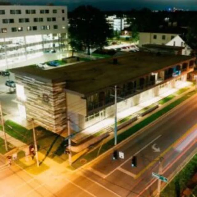 Modern building with stone accents exterior nighttime at WestEdge in Springfield Student Accommodation