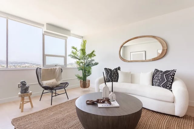 White couch and coffee table living room. at Atlas House Apartments in Los Angeles Student Accommodation