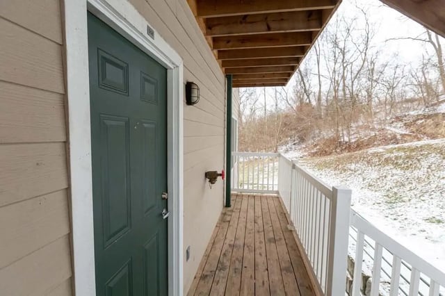 Green door and wooden deck exterior at Metro Towers in Morgantown Student Accommodation