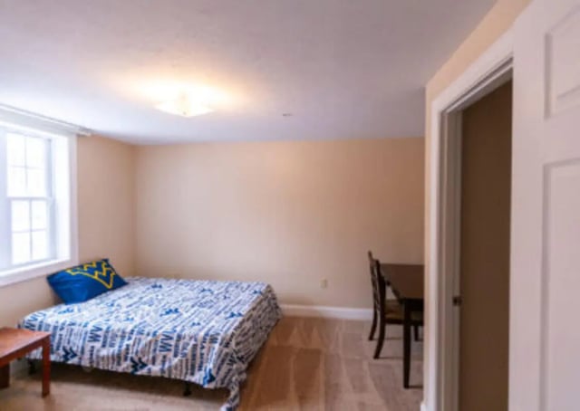 Bed with blue pillow desk with chair Bedroom at Central Place in Morgantown Student Accommodation