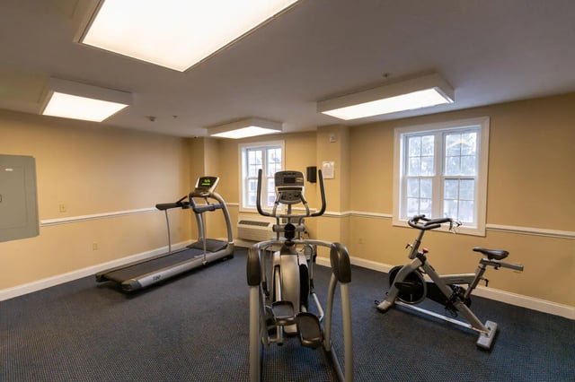 Treadmill elliptical stationary bike gym fitness room at Central Place in Morgantown Student Accommodation