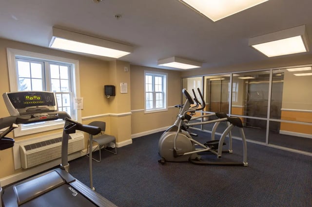 Treadmill elliptical and chair fitness room at Central Place in Morgantown Student Accommodation