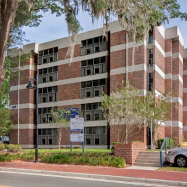 Brick apartment building with multiple floors exterior at Apartments Near UF in Gainesville Student Accommodation