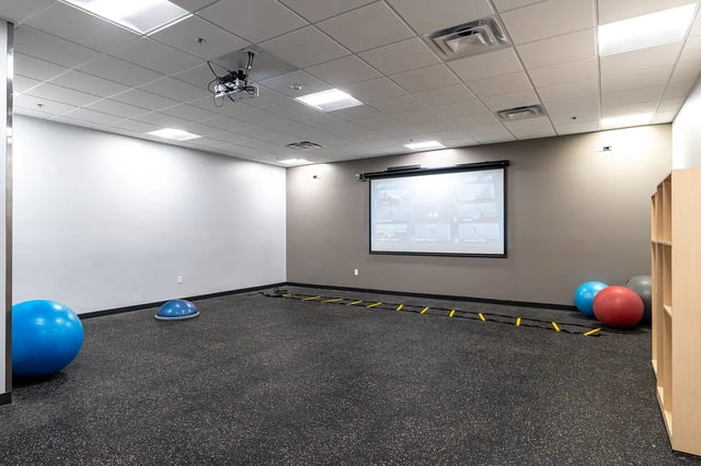 Projection screen exercise balls agility ladder gym at Station 21 in West Lafayette Student Accommodation