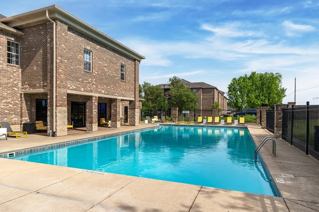Pool with lounge chairs exterior at Station 21 in West Lafayette Student Accommodation