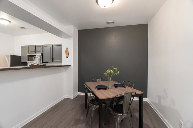 Dining table with four chairs kitchen area exterior at Station 21 in West Lafayette Student Accommodation