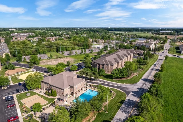 Apartment buildings pool and sports courts exterior at Station 21 in West Lafayette Student Accommodation
