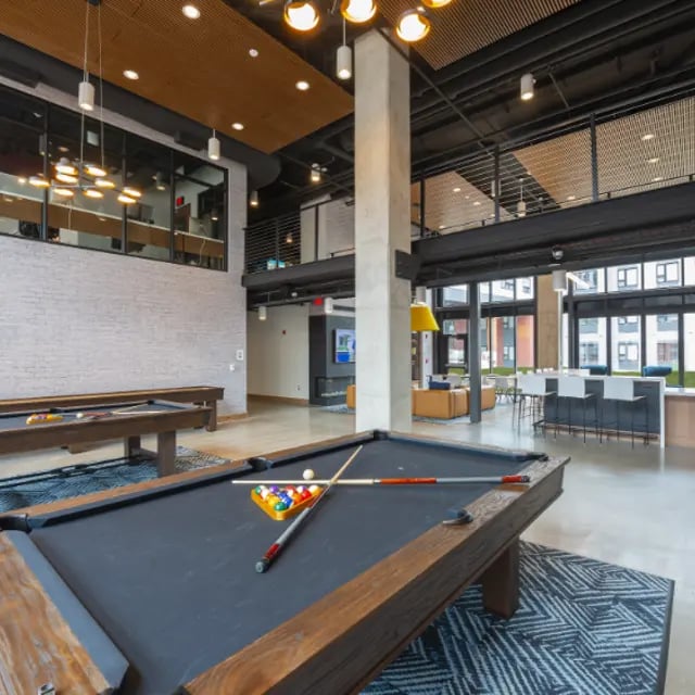 Pool tables and bar seating communal area at Apex Apartments in Rochester Student Accommodation