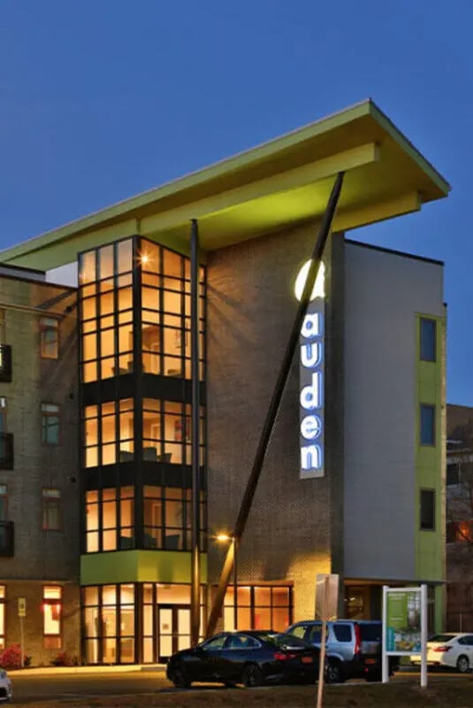 Modern student accommodation building with illuminated windows exterior at Auden Albany in Albany Student Accommodation