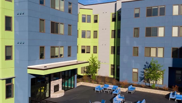 Blue and green building outdoor seating area exterior at Auden Albany in Albany Student Accommodation
