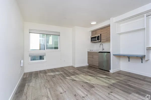 Kitchenette with microwave sink and cabinets kitchen area at Juno Studios in Seattle Student Accommodation