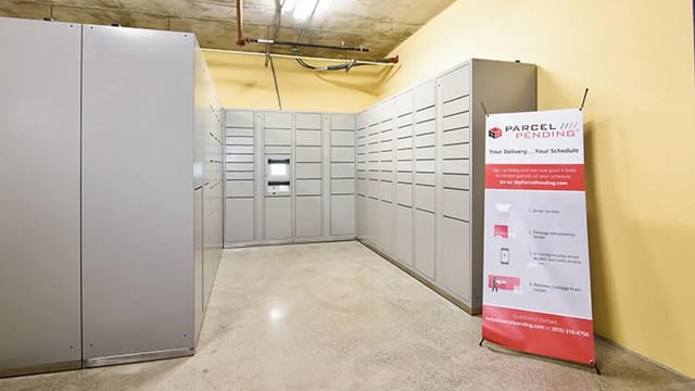 Mail lockers and sign Parcel Pending area exterior at Fifty Twenty-Five Apartments in San Diego Student Accommodation