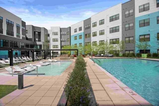 Pool with lounge chairs and buildings exterior at Park Place Tempe in Tempe Student Accommodation